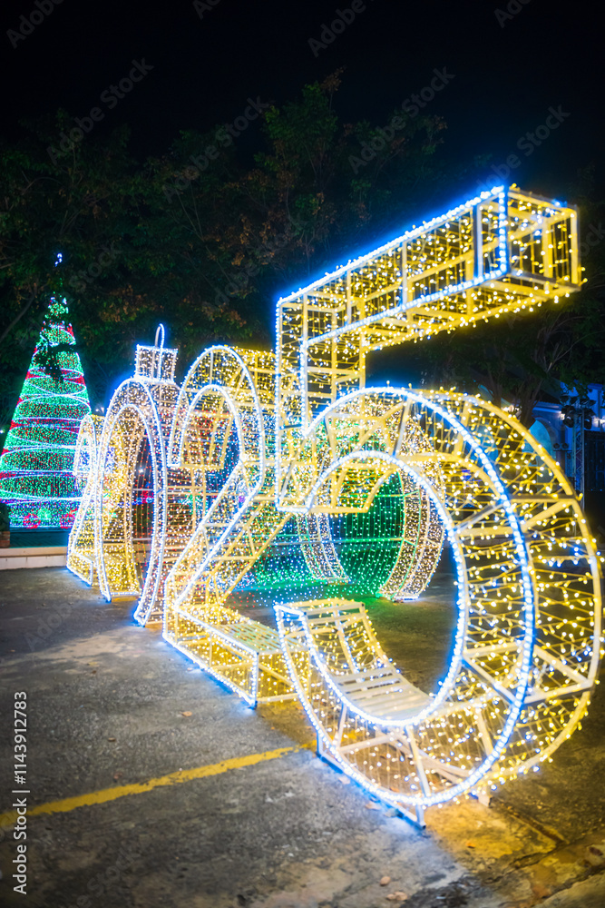 PHITSANULOK, THAILAND - December 15,2024:Decoration lights Christmas tree for celebrate Christmas and New Year Festival 2025 illumination at Saint Nicholas School in Phitsanulok City at night
