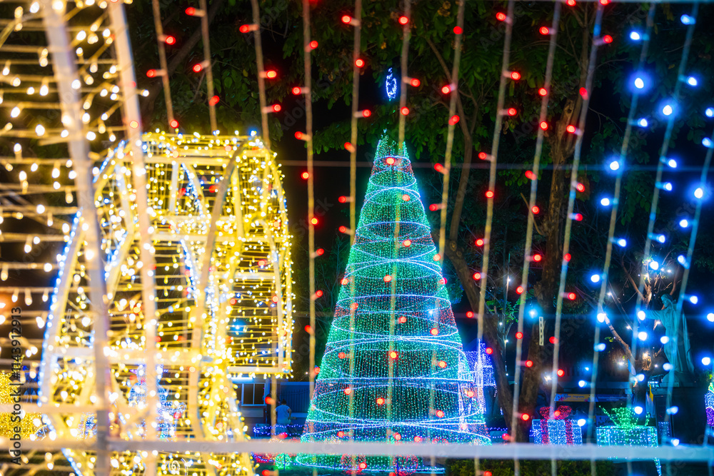PHITSANULOK, THAILAND - December 15,2024:Decoration lights Christmas tree for celebrate Christmas and New Year Festival 2025 illumination at Saint Nicholas School in Phitsanulok City at night