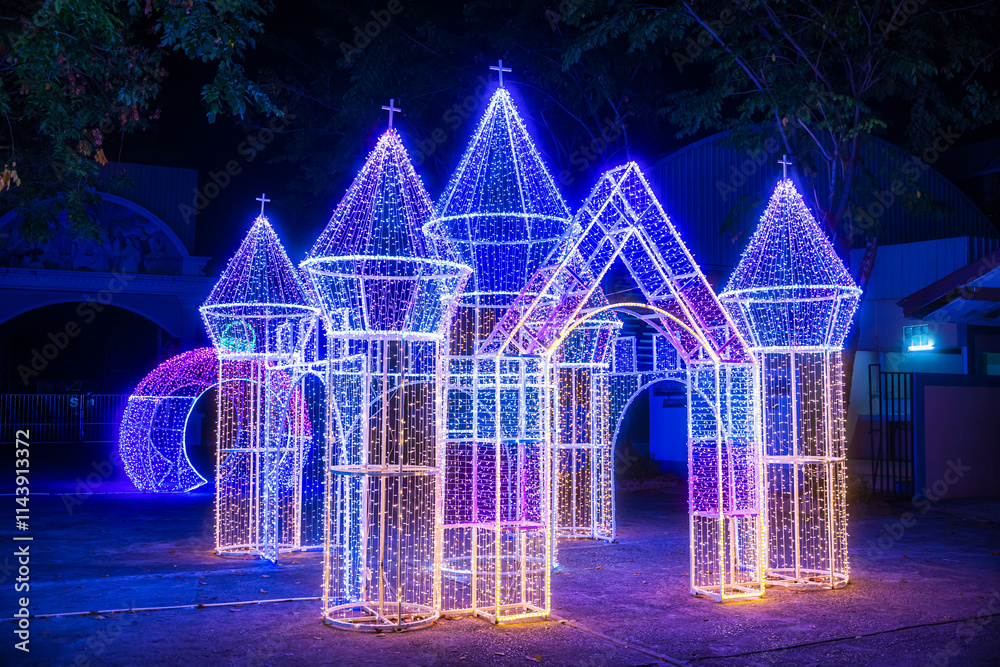 PHITSANULOK, THAILAND - December 15,2024:Decoration lights Christmas tree for celebrate Christmas and New Year Festival 2025 illumination at Saint Nicholas School in Phitsanulok City at night