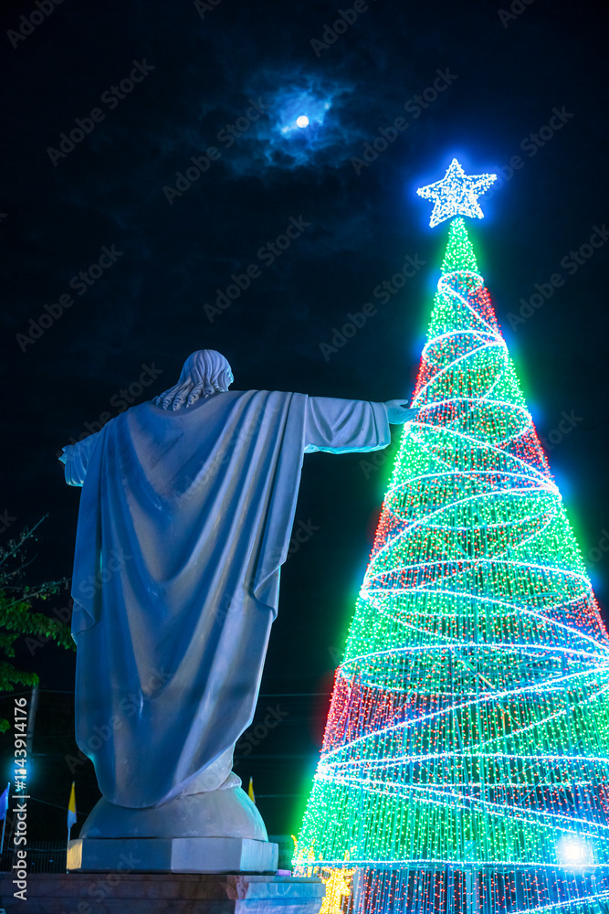 PHITSANULOK, THAILAND - December 15,2024:Decoration lights Christmas tree for celebrate Christmas and New Year Festival 2025 illumination at Saint Nicholas School in Phitsanulok City at night