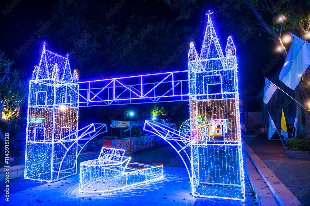PHITSANULOK, THAILAND - December 15,2024:Decoration lights Christmas tree for celebrate Christmas and New Year Festival 2025 illumination at Saint Nicholas School in Phitsanulok City at night
