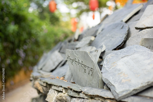 Tibetan sanskrit text engraved on stone photo