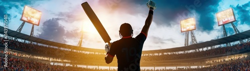 A silhouette of a cricketer raising a bat in celebration, with a stadium backdrop illuminated by floodlights during sunset.