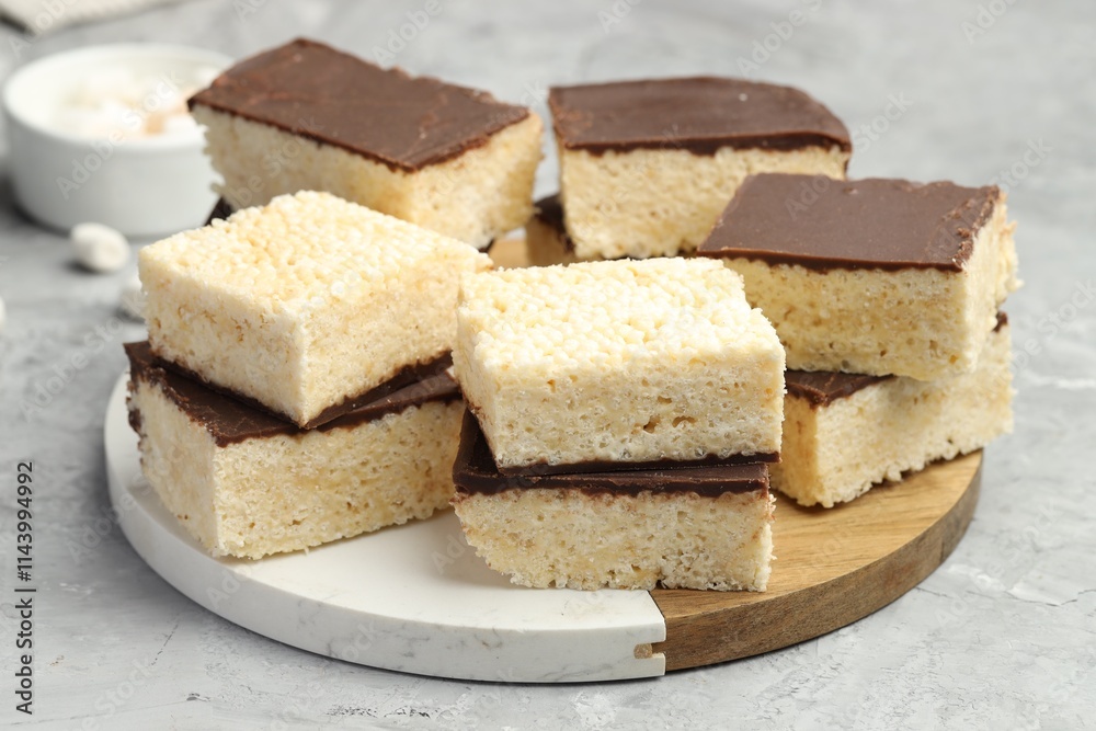 Delicious puffed rice bars on gray textured table, closeup Delicious puffed rice bars on gray textured table, closeup