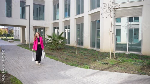 Wallpaper Mural Contemporary Architectural Walkway Featuring a Professional Woman Strolling Through Nature Torontodigital.ca