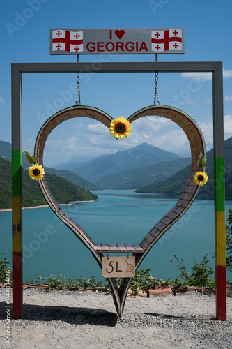 Big heart next to water reservoir artificial lake Zhinvali in Georgia photo