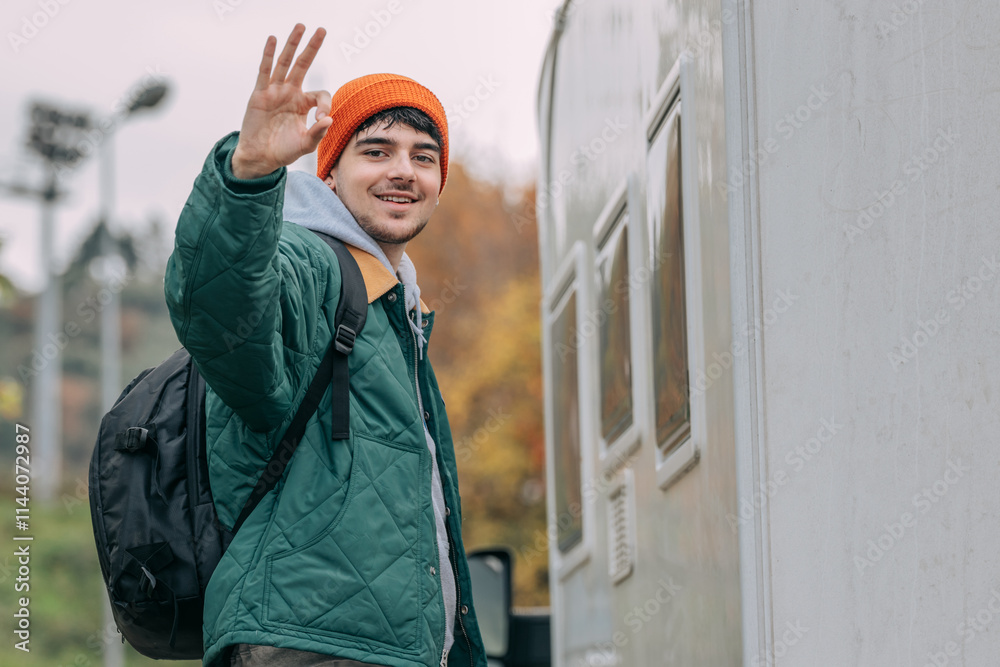 young man or traveler with backpack waving young man or traveler with backpack waving