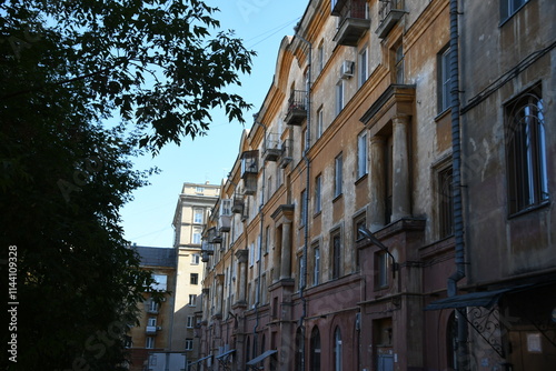 Architecture of old Soviet Union houses in Stalin's Empire style. Exterior of the facade of a vintage residential building in Russia