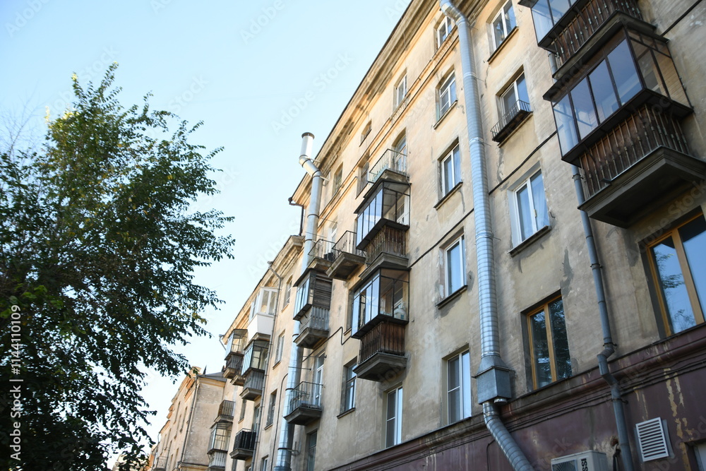 Fototapeta premium Architecture of old Soviet Union houses in Stalin's Empire style. Exterior of the facade of a vintage residential building in Russia