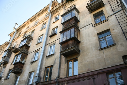 Architecture of old Soviet Union houses in Stalin's Empire style. Exterior of the facade of a vintage residential building in Russia