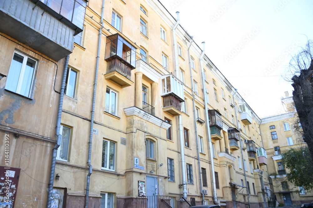Architecture of old Soviet Union houses in Stalin's Empire style. Exterior of the facade of a vintage residential building in Russia Architecture of old Soviet Union houses in Stalin's Empire style. Exterior of the facade of a vintage residential building in Russia