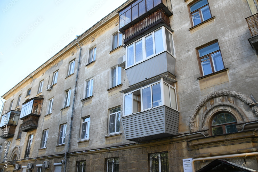 Fototapeta premium Architecture of old Soviet Union houses in Stalin's Empire style. Exterior of the facade of a vintage residential building in Russia