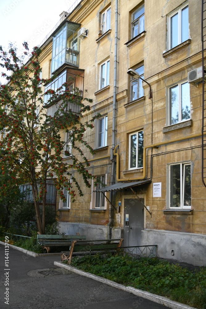 Architecture of old Soviet Union houses in Stalin's Empire style. Exterior of the facade of a vintage residential building in Russia Architecture of old Soviet Union houses in Stalin's Empire style. Exterior of the facade of a vintage residential building in Russia
