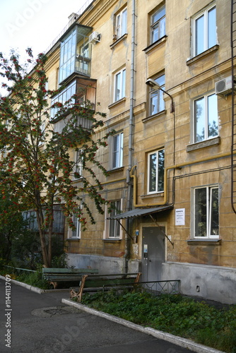Architecture of old Soviet Union houses in Stalin's Empire style. Exterior of the facade of a vintage residential building in Russia
