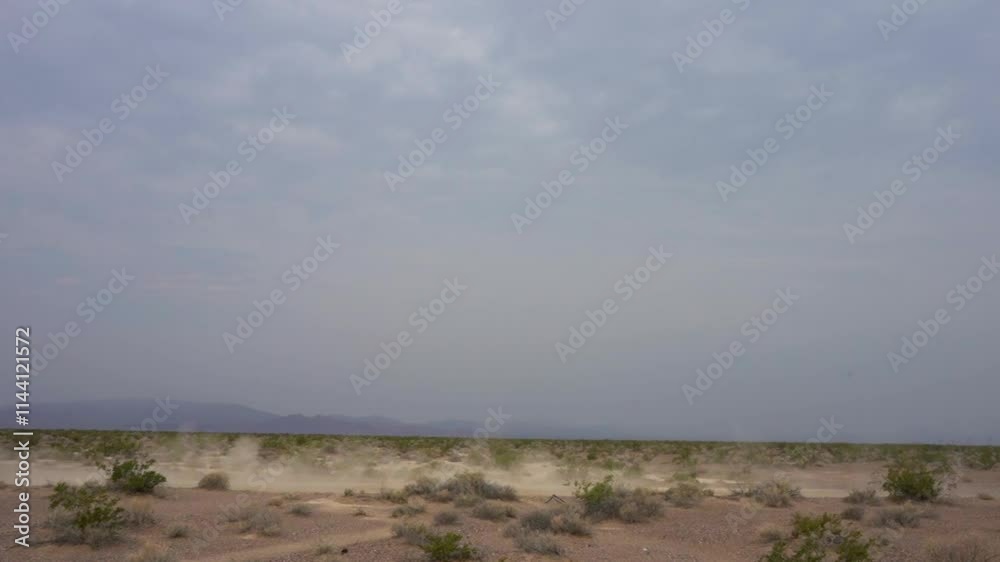 Car crossing a lush desert landscape. High quality FullHD footage Car crossing a lush desert landscape. High quality FullHD footage
