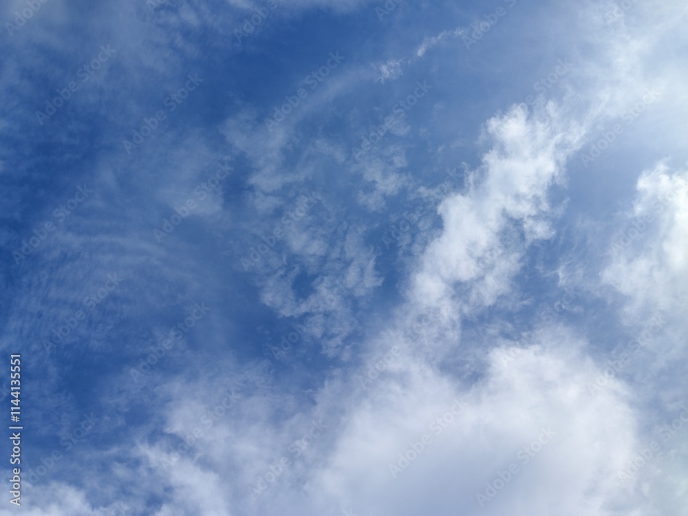 Obraz premium Clear Blue Sky with Wispy Clouds