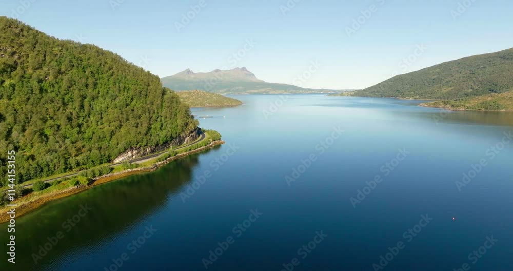 Gratangen or Rivtták, fjord, summer season, vivid colors, serene blue waters, Troms, Norway. Aerial forward, copy space Gratangen or Rivtták, fjord, summer season, vivid colors, serene blue waters, Troms, Norway. Aerial forward, copy space