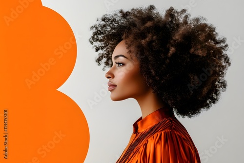 side profile of a black woman with afro hairstyle and orange dress on minimal background with modern art elements
