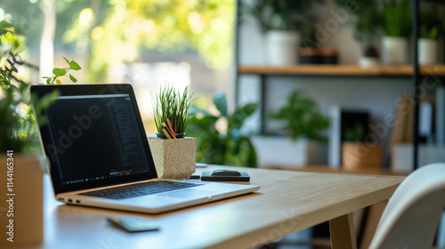 Wallpaper Mural Modern office workspace featuring plants and laptop near large windows in daylight Torontodigital.ca