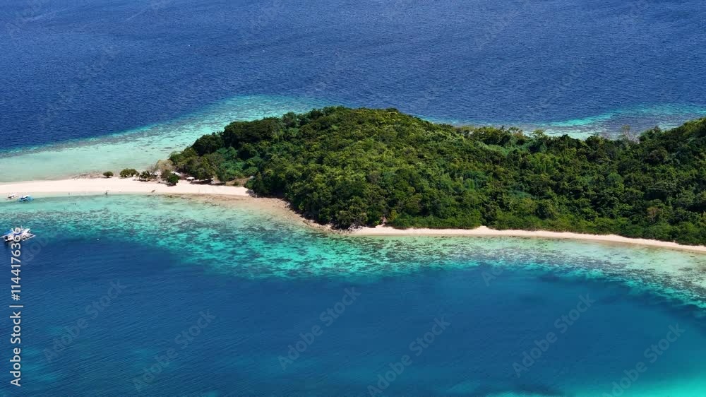 Aerial perspective of Bulog Dos Island, highlighting its serene beach and lush surroundings. Aerial perspective of Bulog Dos Island, highlighting its serene beach and lush surroundings.