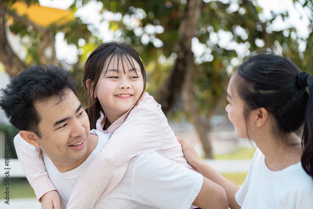 Happy Family Enjoying Outdoor Wellness Activities Together in a Park Setting Happy Family Enjoying Outdoor Wellness Activities Together in a Park Setting