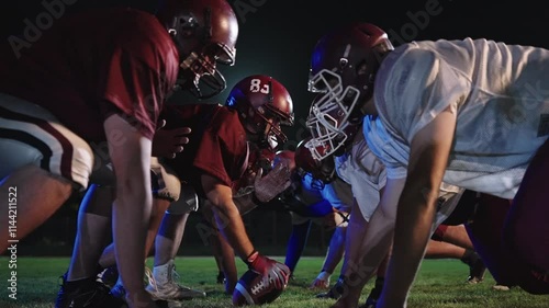 American Football Championship Start Teams Ready: Professional Players, Aggressive Face-off, Start Pushing, Tackling. Competition Full of Brutal Energy, Skill. Cinematic Slow Motion. Dramatic Sport