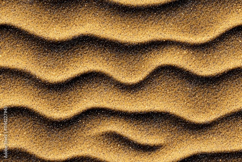 Abstract sand pattern showcasing golden waves, ideal for backgrounds and artistic projects. photo