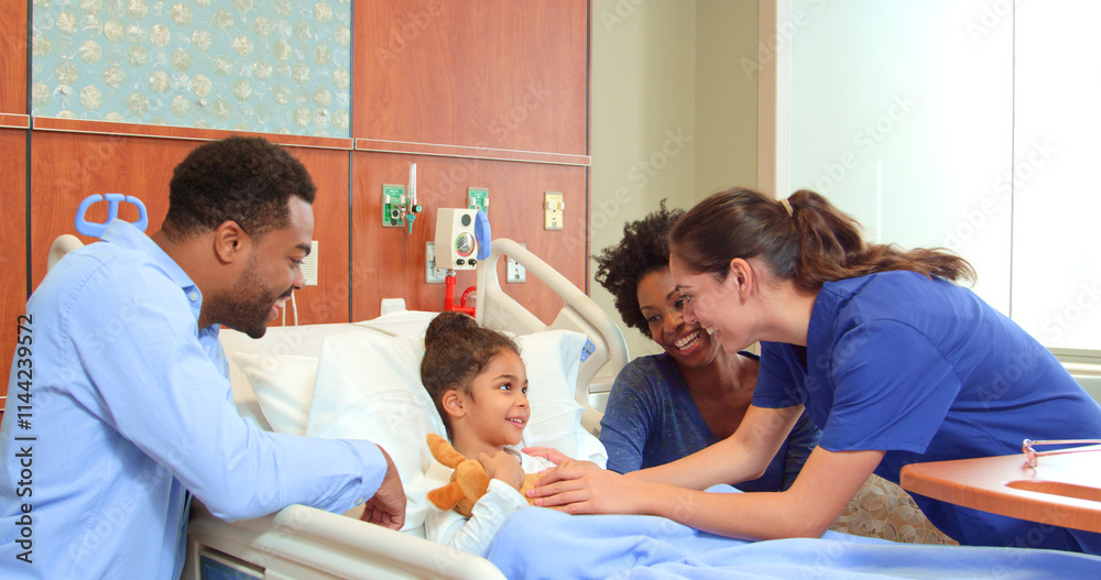 Obraz premium Close Up Of Female Doctor Or Nurse With Soft Toy Meeting Parents Visiting Daughter In Hospital Bed