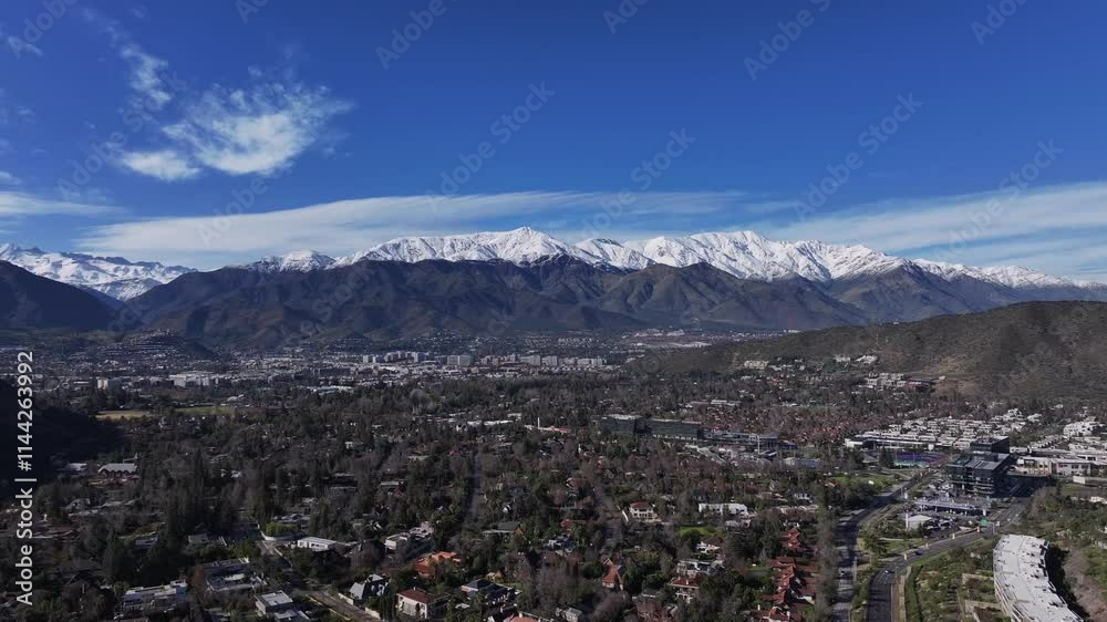 aerial panning with drone of the snowy Andes mountain range, from Lobarnechea, Santiago de Chile, you can see the snowy mountain range aerial panning with drone of the snowy Andes mountain range, from Lobarnechea, Santiago de Chile, you can see the snowy mountain range