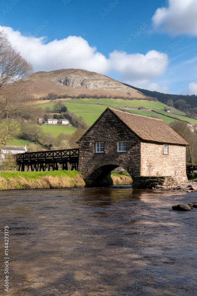 Stone bridge house over river, hills, blue sky. Stone bridge house over river, hills, blue sky.