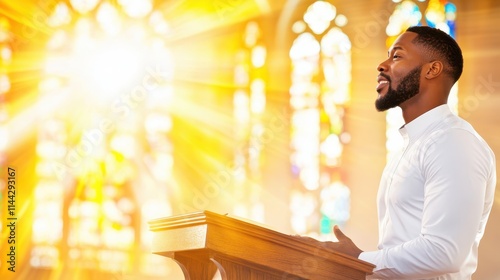 A Black male preacher in a white shirt delivers a sermon at a podium with sunlight streaming through stained-glass windows, symbolizing faith and spirituality.