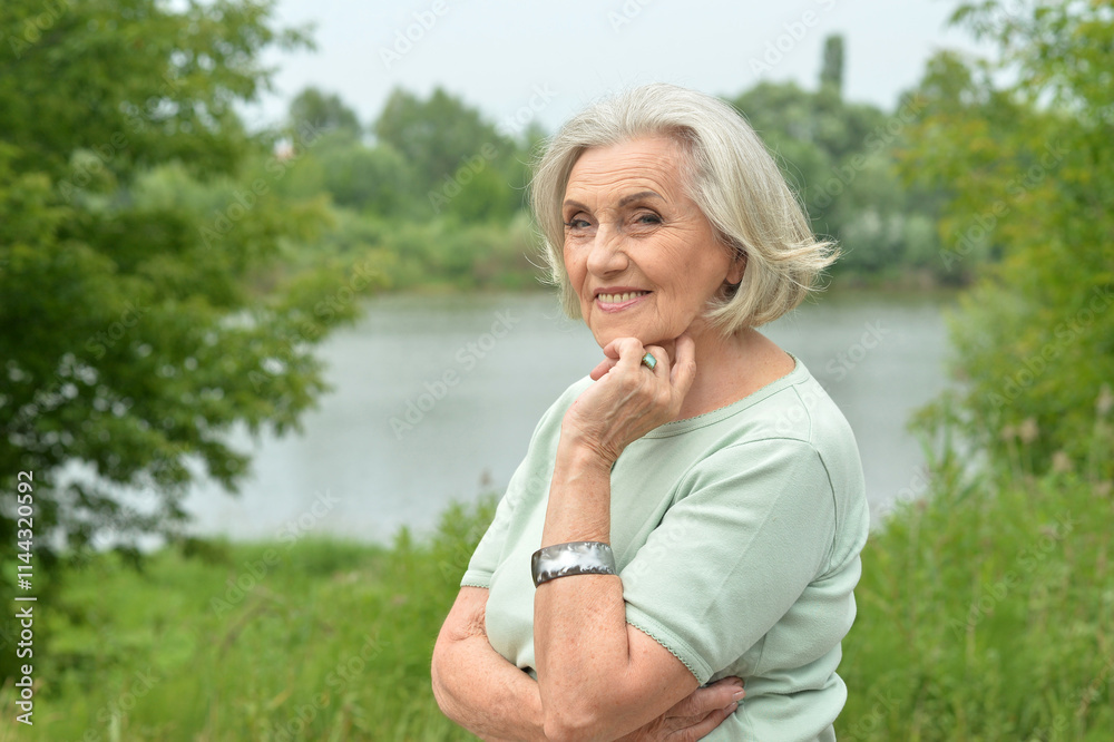 Portrait of a beautiful elderly woman in the park Portrait of a beautiful elderly woman in the park