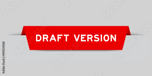 Red color inserted label with word draft version on gray background