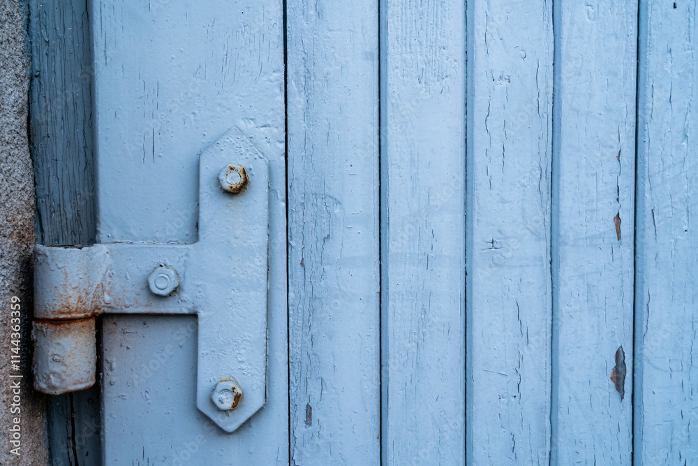 Old hinge on a garage door as a background. Old hinge on a garage door as a background.