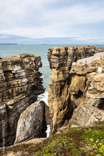 Cross on the coast of the Atlantic Ocean at Cruz dos Remedios, Peniche peninsula, Portugal photo