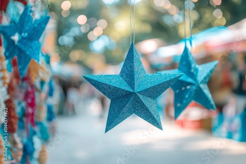 A photograph taken from below highlights the bright Christmas lantern parol stars with a bokeh effect. photo