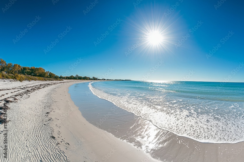 Fototapeta premium The sun's rays create a stunning shine in the sky as they illuminate the bright ocean.