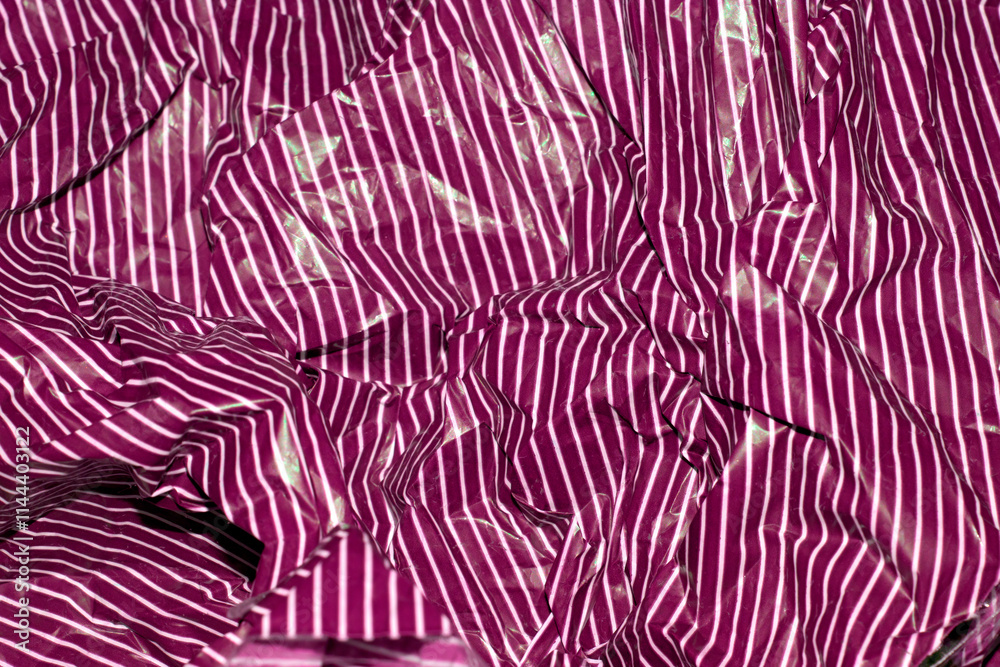 Sweet Wrapper Fine Stripes Lines on Plastic Paper Crumpled Warped Vertical or Horizontal Lined Background Sweet Wrapper Fine Stripes Lines on Plastic Paper Crumpled Warped Vertical or Horizontal Lined Background