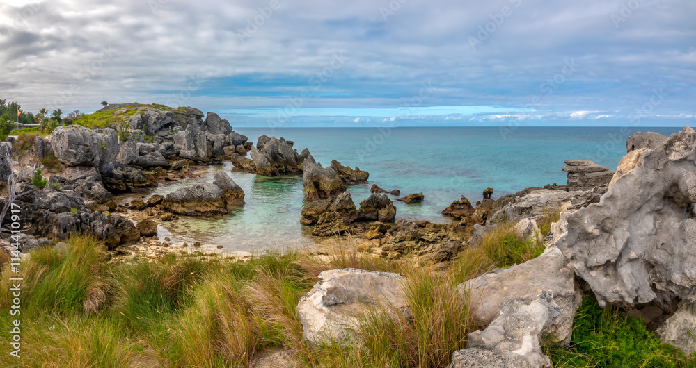 Grass fields growing among the rugged rock formations on the north coast of St. George Island, Bermuda, British Overseas Territory, UK Grass fields growing among the rugged rock formations on the north coast of St. George Island, Bermuda, British Overseas Territory, UK