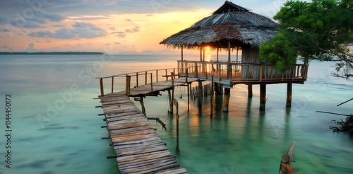 Wallpaper Mural Stunning sunset over tranquil waters with a pier leading to a beach hut Torontodigital.ca