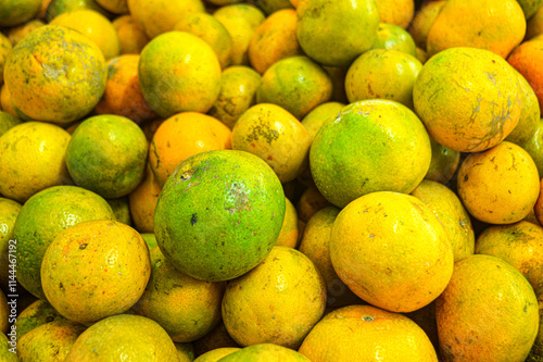 Orange citrus fruits in a fruit shop basket. Focus on fruit, noisy, exposure, similar others