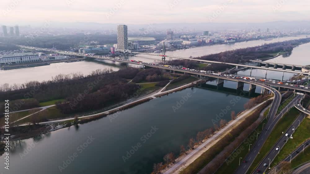 Austria, Vienna: Bridges Over the Danube River with Heavy Traffic. A dynamic aerial view showcasing the bustling flow of vehicles across Vienna's iconic bridges. Austria, Vienna: Bridges Over the Danube River with Heavy Traffic. A dynamic aerial view showcasing the bustling flow of vehicles across Vienna's iconic bridges.