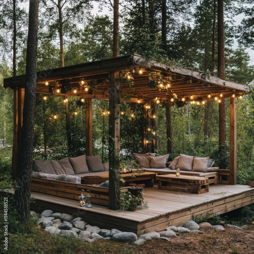 Cozy outdoor lounge area decorated with string lights and surrounded by lush ...