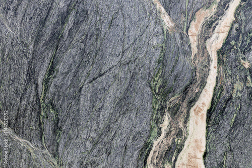 A fragment of natural gray-green marble, granite slab with interesting patterns