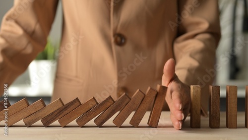 Crisis Management Assessment in Business Planning for Financial Risks with Wooden Dominoes in 4K Stock Video Risk Management and Economic Analysis photo