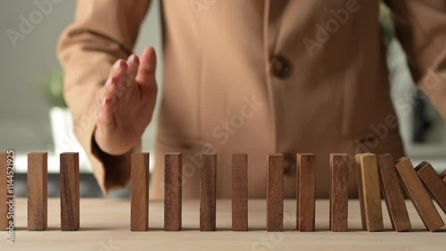 Crisis Management Assessment Business Risk Planning with Wooden Domino Effect Economic Environment 4K Stock Video Financial Risk Control