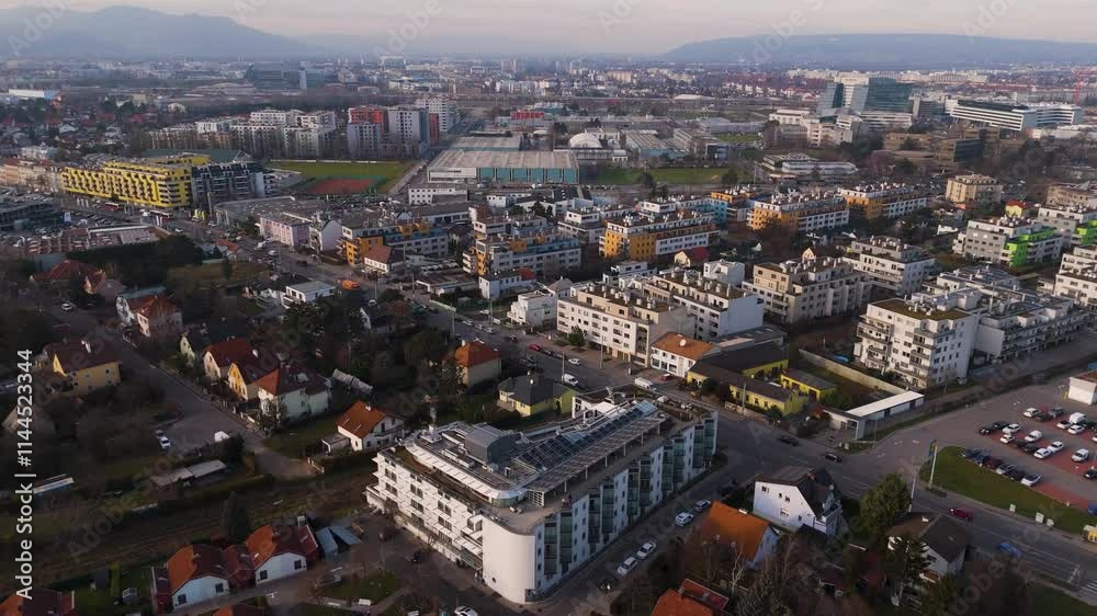Austria, Vienna: Top Aerial View of Quiet Residential Areas in Districts 21 & 22. A peaceful perspective showcasing the serene neighborhoods of the Austrian capital Austria, Vienna: Top Aerial View of Quiet Residential Areas in Districts 21 & 22. A peaceful perspective showcasing the serene neighborhoods of the Austrian capital