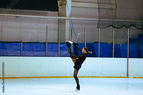 Figure skater girl in skating ice.