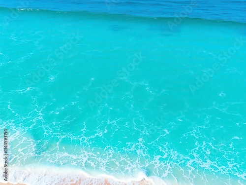 Pure blue turquoise water with foamy white waves crashing on shore, turquoise, sea