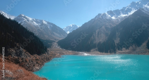 Beautiful Big Almaty Lake in the mountains in autumn, it is high mountain and located near the city of Almaty in Kazakhstan photo